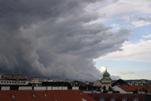 Cloudscape of a storm front over the roofs of the city of Vienna