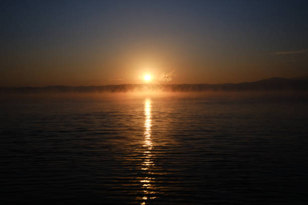 Clouds that look like ghosts staring at the morning sun