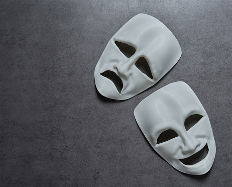 theatre theater theatrical tragedy drama comedy mask on grey background. theatre theater theatrical tragedy drama comedy mask. white happy and sad theatre theater theatrical tragedy drama comedy mask