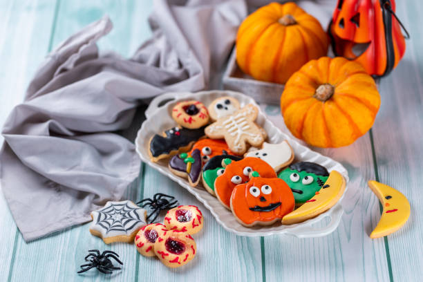 istock Fresh halloween cookies on blue wooden table 1729017153