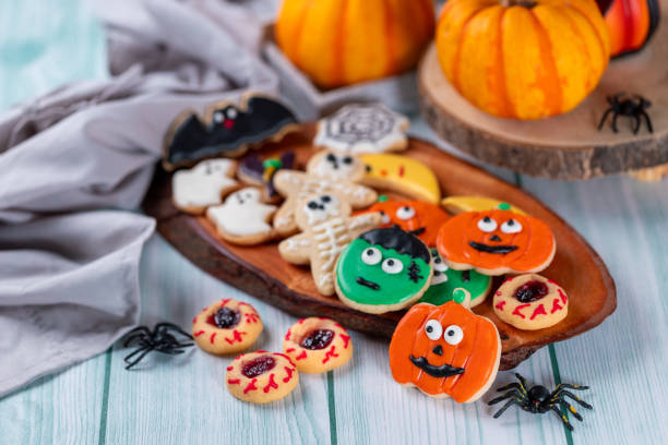 istock Fresh halloween cookies on blue wooden table 1729017154