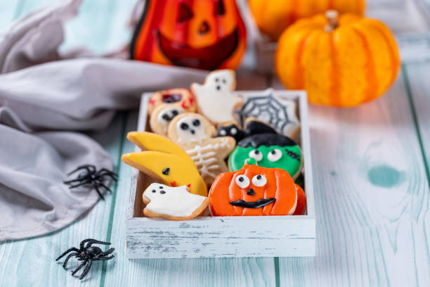 istock Fresh halloween cookies on blue wooden table 1729017156