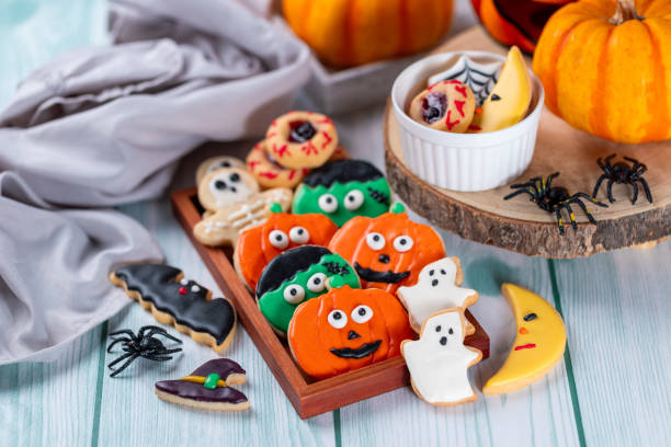 istock Fresh halloween cookies on blue wooden table 1729017157
