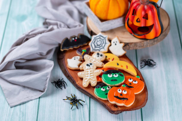istock Fresh halloween cookies on blue wooden table 1729017158
