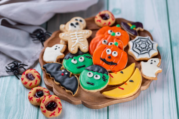 istock Fresh halloween cookies on blue wooden table 1729017161
