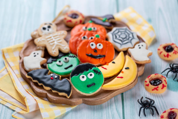 istock Fresh halloween cookies on blue wooden table 1729017164