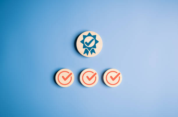 istock ISO certification and standardization with check mark assure icons on wooden circles. Top service and best quality assurance, Standard guarantee service and product concept. QC, QA, Quality control. 1729017900
