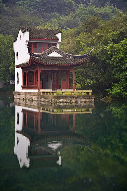 Traditional Chinese House in a Lake stock photo