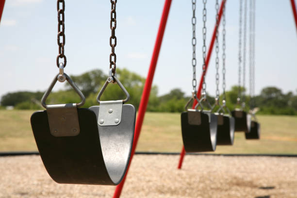 istock Empty Swing Set At A School Playground In The Summer 172902148
