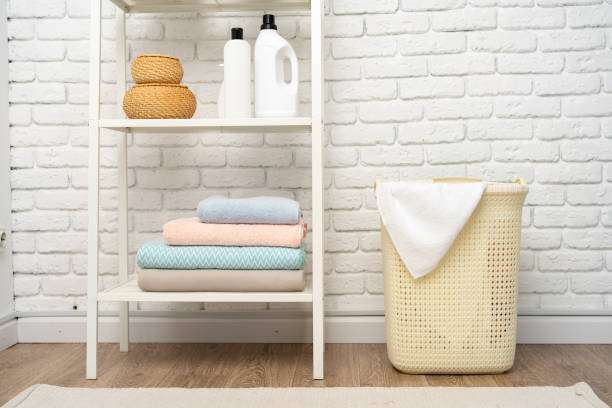 istock Beige plastic basket for laundry in a room 1729024143
