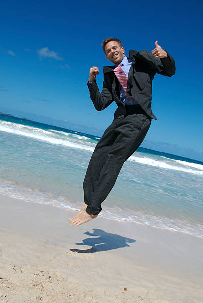 istock Businessman Bounces on Beach w Thumbs Up 172902484