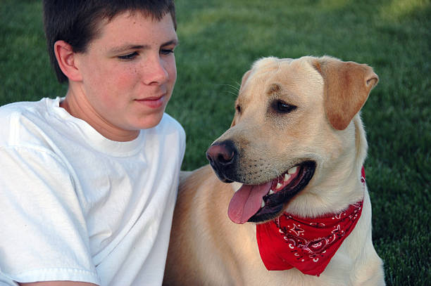 eight years old boy wit his dog isolated on white