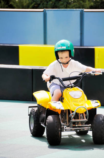 istock boy racing on quadbike 172902731