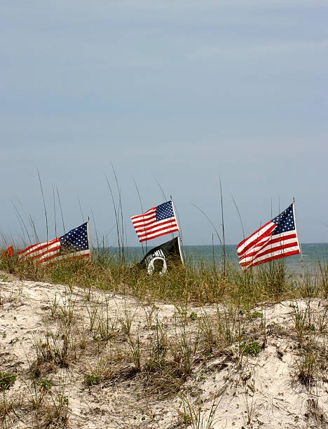 istock Beach Dunes With POW-MIA & American Flags In Background 172903002