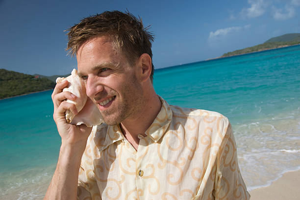 istock Man Smiles on His Shell Phone 172903121