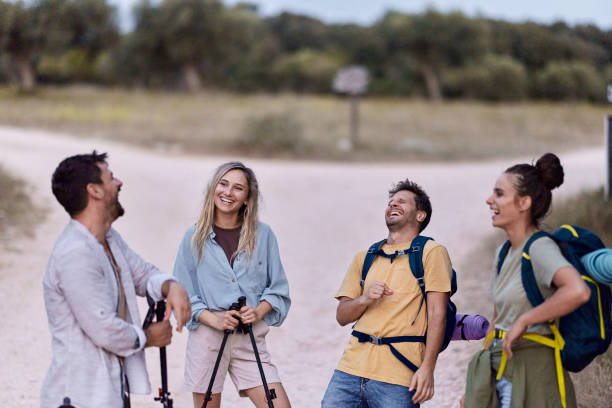 istock Cheerful backpackers talking on a break from hike in nature. 1729033077