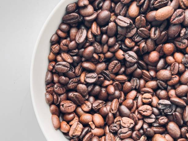 istock Closeup coffee bean, Arabica, Robusta in a large cup. 1729038386