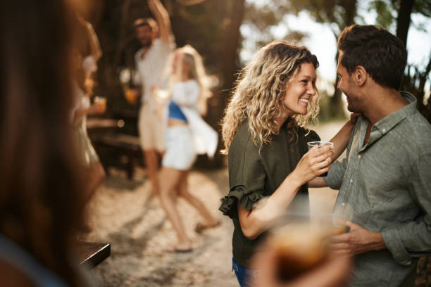 istock Happy couple talking during spring party in nature. 1729042591