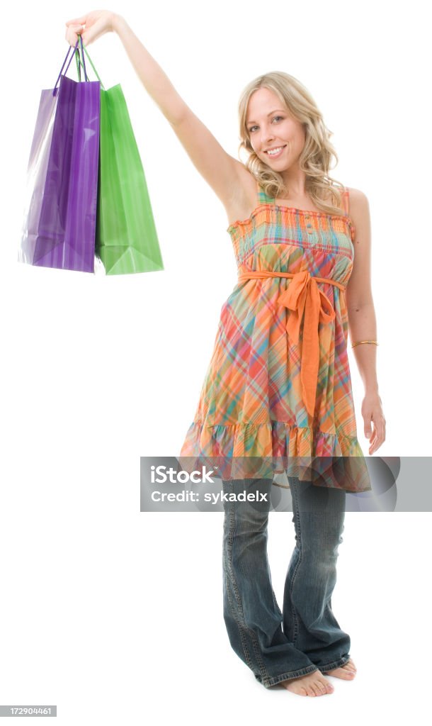 Summer Shopper An attractive girl in a fun summer outfit holding out some shopping bags. 20-29 Years Stock Photo