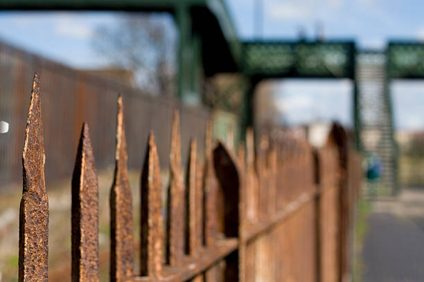 rusted fence spikes stock photo