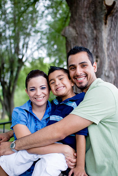 istock Mother and father embracing child 172904929