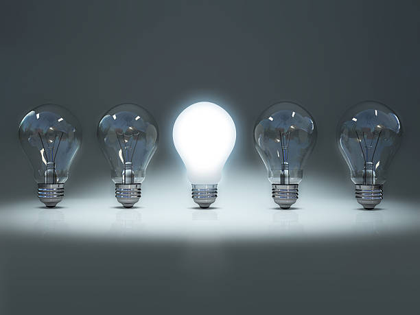 istock Lit bulb among unlit bulbs to convey individuality 172905331