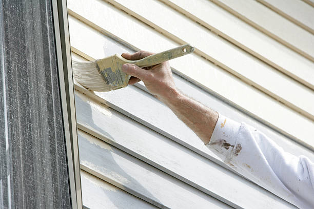 Painter performing trim work in house stock photo