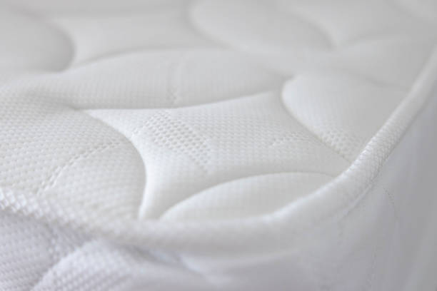istock the white soft mattress background and texture. white new bed without dust mites. concept : allergy in bed room 1729069010