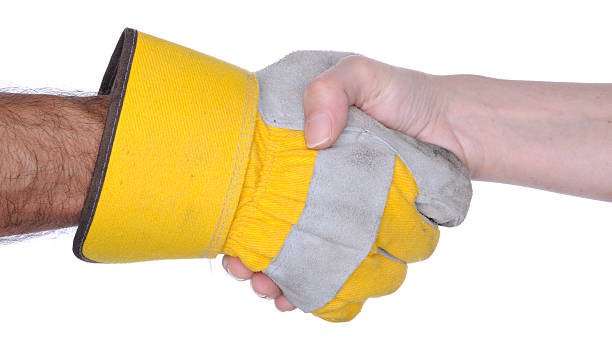 handshake: eine hand mit arbeitshandschuh - construction dirt dirty manual worker stock-fotos und bilder