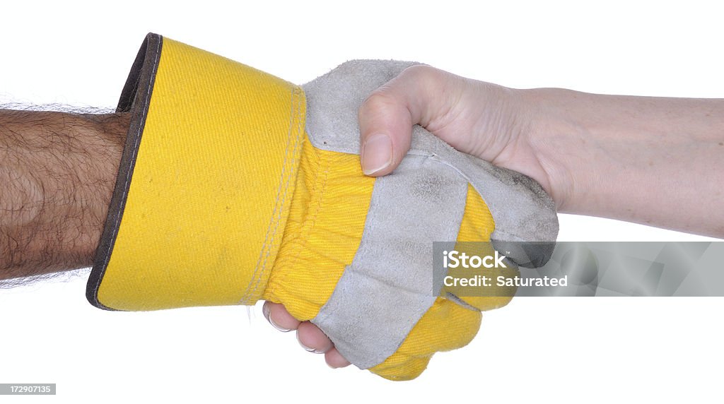 Handshake: One Hand with Work Glove "Two hands shaking, one with a used work glove on, the other with no glove. Isolated on white background." Handshake Stock Photo