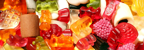 Fruity mix background Close up of a mixture of fruity colorful sweets useful as a background. The mixture is also including some licorice and vinous . aromatisch stock pictures, royalty-free photos & images