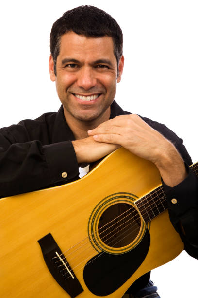 istock Smiling Hispanic man holding a guitar, white background 172907744