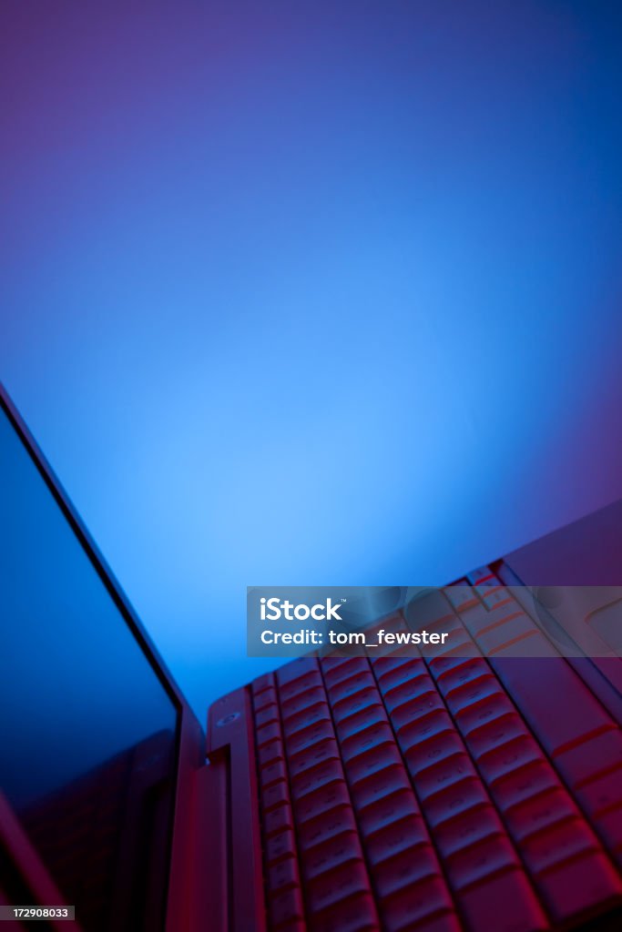 Laptop computer Laptop computer illuminated with blue and red lights Blue Stock Photo