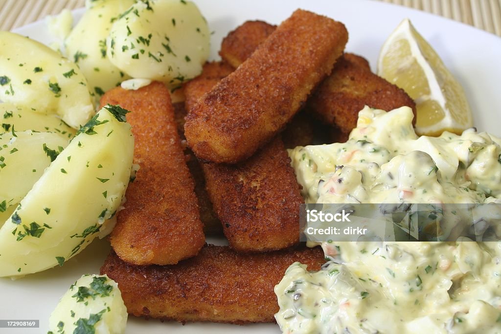 Fish fingers Fish fingers with Tartar sauce and parsley potatoes Breaded Stock Photo
