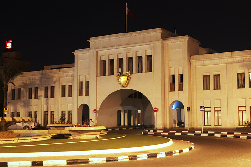 The vintage gate Bab el-Bahrain Souk in Manama at night, Bahrain