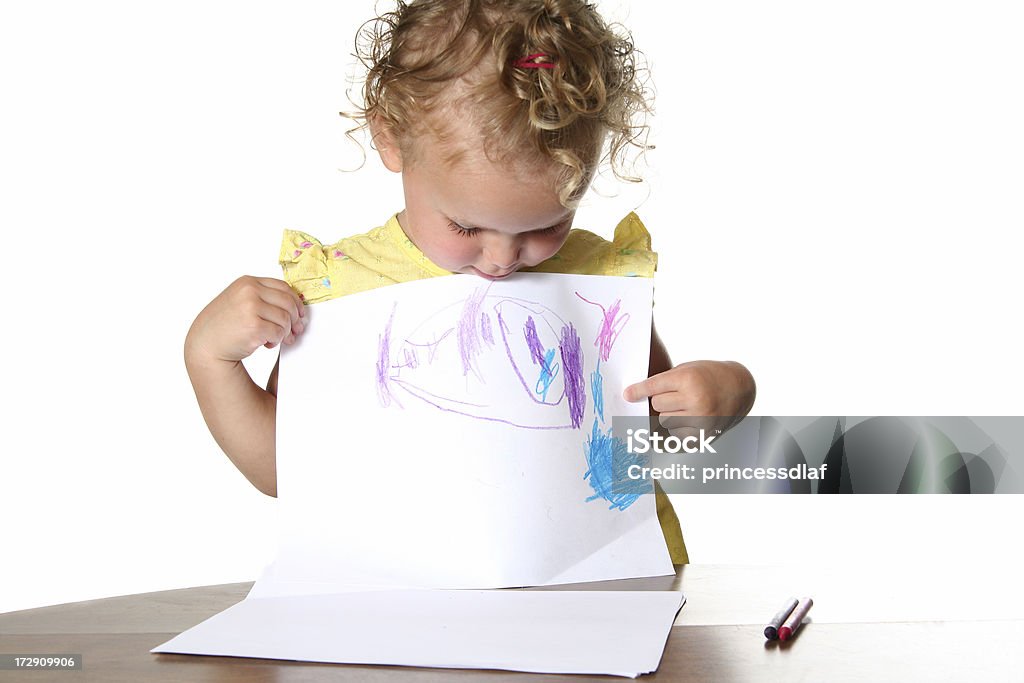 Look What I Made! Little girl showing off the picture she colored Toddler Stock Photo