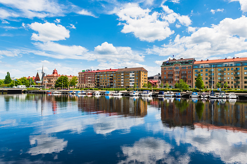 Buildings at Halmstad city in front of still river, Sweden