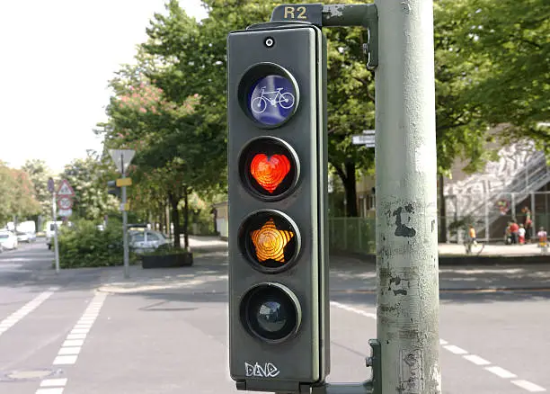 Traffic light with street art in Berlin