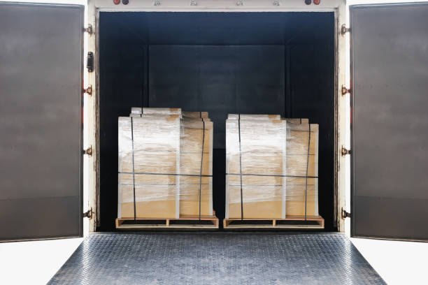 istock Package Boxes Wrapped Plastic on Wooden Pallets Loads into Container Truck. Distribution Supplies Warehouse Shipping. Supply Chain, Shipment. Freight Truck Logistic, Cargo Transport. 1729108112