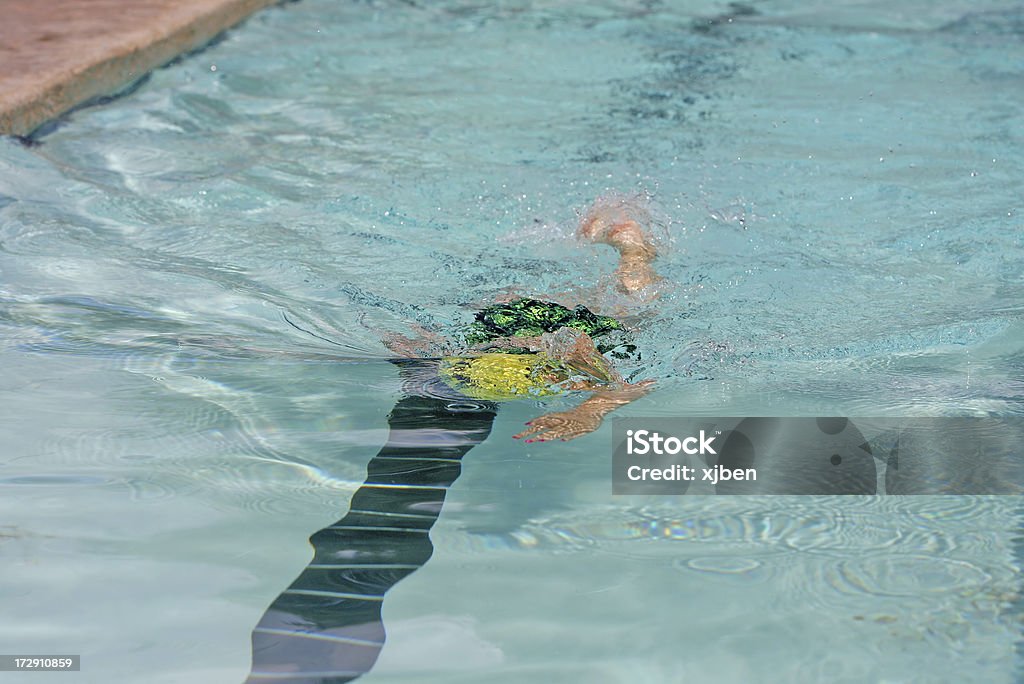 Swimming Racer Swimmer speeding through the water during a race. Active Lifestyle Stock Photo