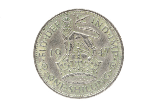 A British shilling from 1947.  This is the reverse of the coin showing a lion statant guardant (therefore an English shilling - a Scottish shilling would have a lion rampant).