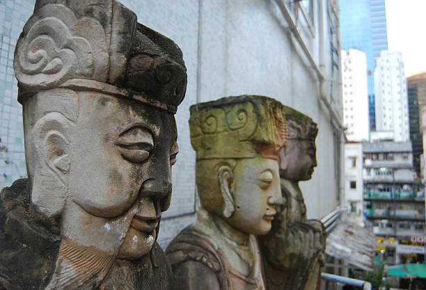 Metaphorical dialogue and exchange of thoughts. Two translucent crystal heads facing each other, spinning in the sky