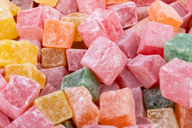 istock Closeup of multicolored cubes Turkish delight (Lokum). Selective Focus. Flat lay. 1729116843