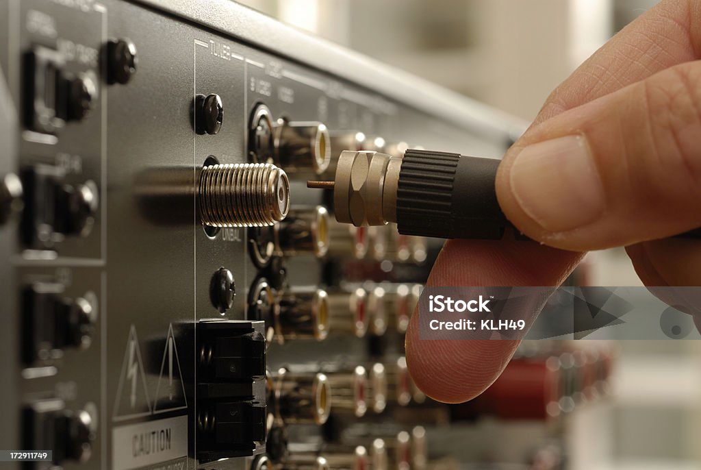 Video Cable being inserted into electronic equipment Composite video cable Coaxial Cable Stock Photo