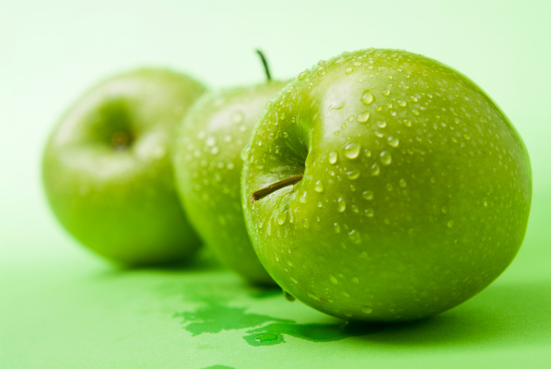 Green apple with water drops isolated on white background, clipping path included
