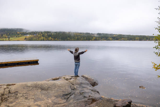 istock Lonely man contemplates nature in autumn 1729132788