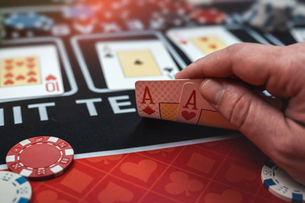 istock player is holding two ace cards - win combination at poker 1729137378