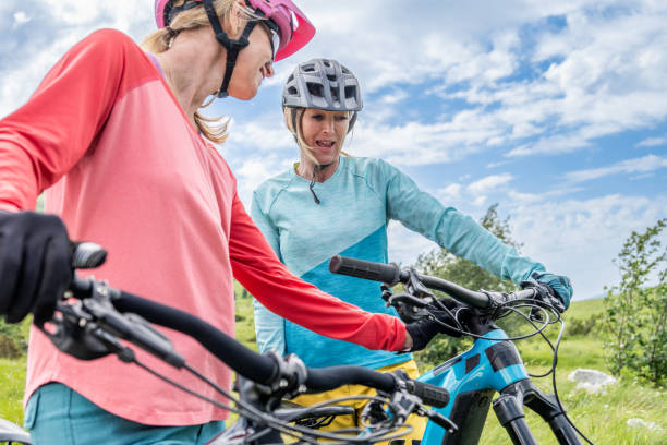istock Women instructing friend before riding electric bike 1729137921