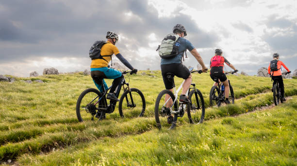 istock Cyclists group riding electric mountain bikes 1729137937