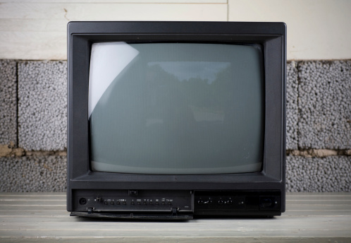 An OLD TV set. Some dust and scratches on this one. A somewhat grungy background.Similar from my portfolio